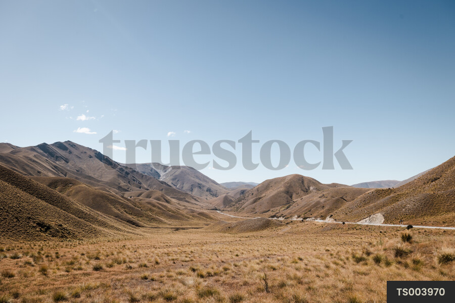 Rural road through dry mountain range