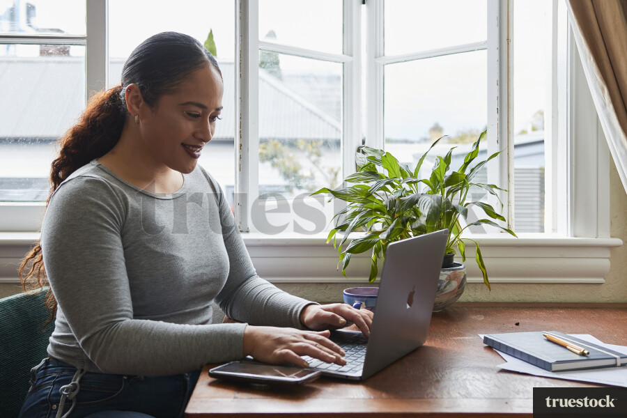 Woman Using Laptop While Working