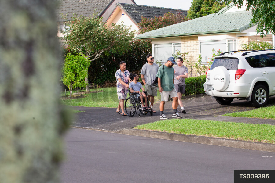 Friends walking on footpath