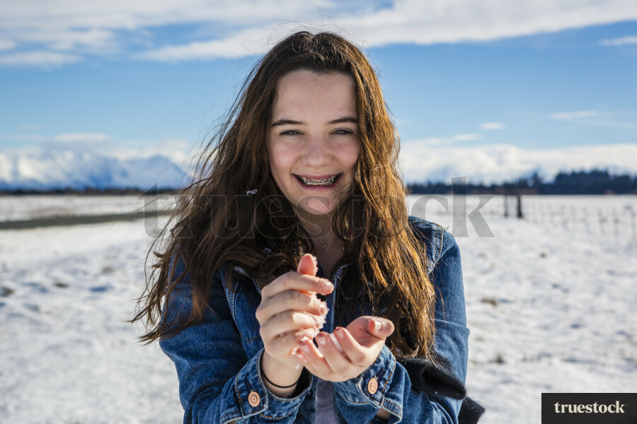 Teen Girl Holding Snow