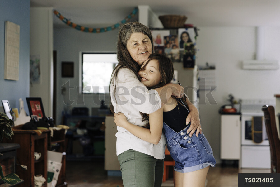 Young Girl Hugging Grandma