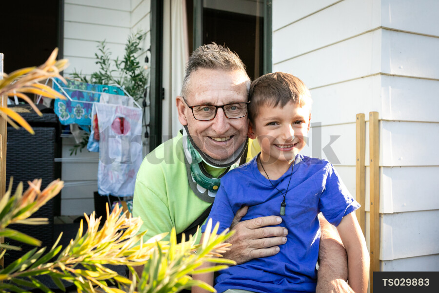 Smiling man with his grandson