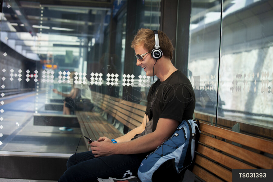 Man Sitting at Train Station