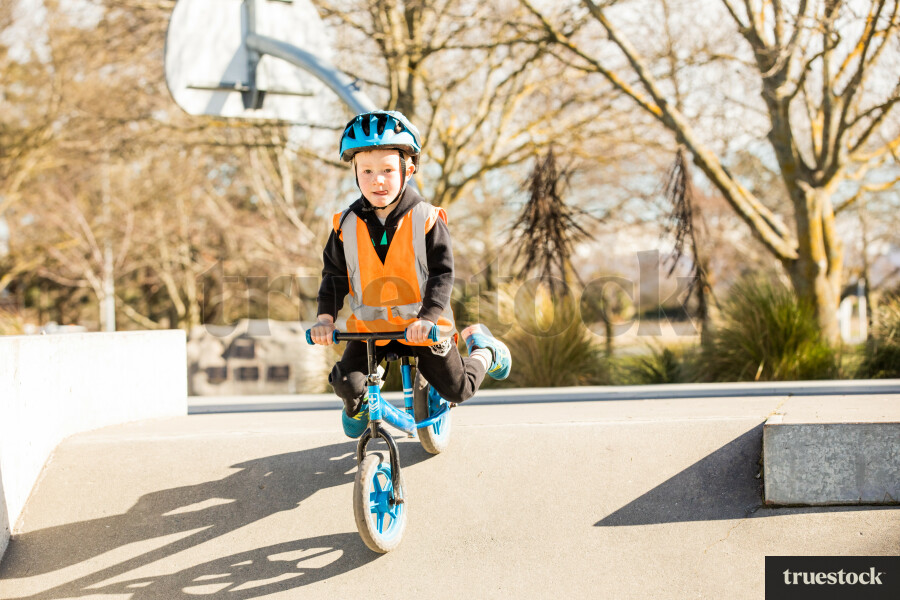 Boy on balance bike at skate park