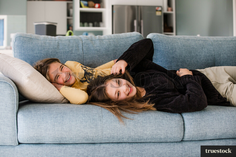 Sisters Lying on the Couch