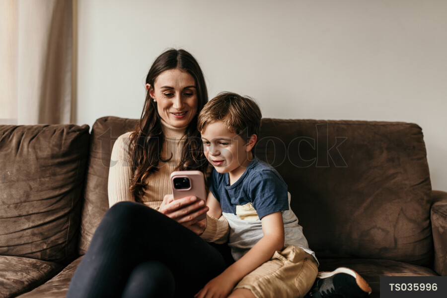 Mother and Son Using Phone