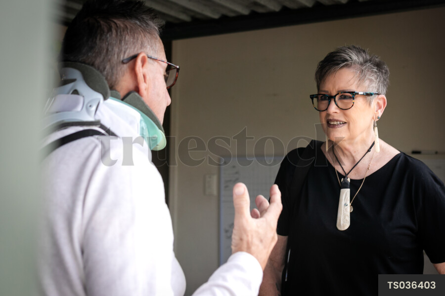 Health carer with patient in garage