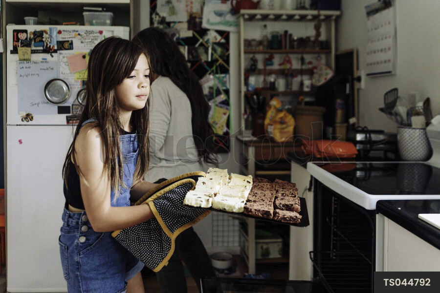 Young Girl Toasting Hot Cross Buns