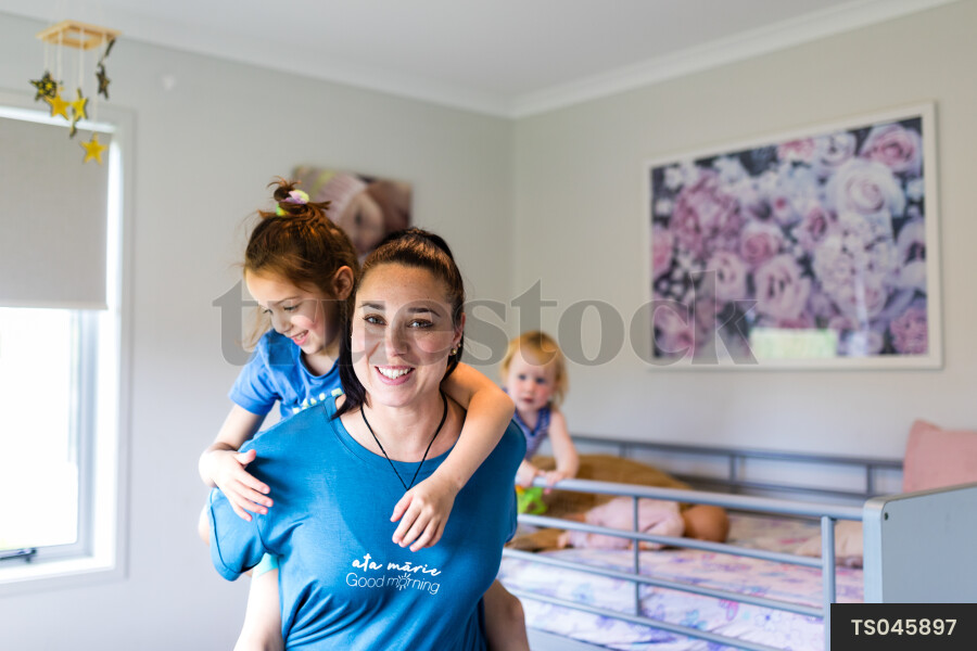 Mother Giving Daughter Piggyback