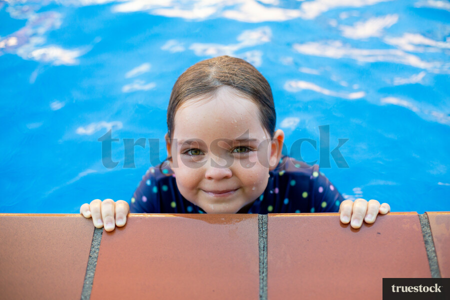 Girl Swimming at the Pools