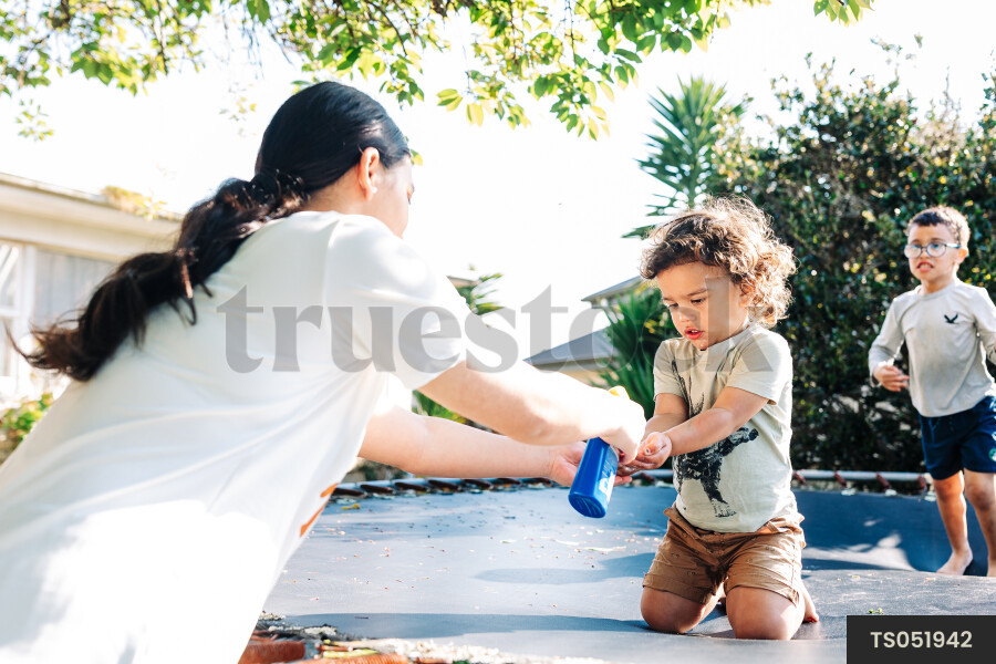 Boys playing on trampoline