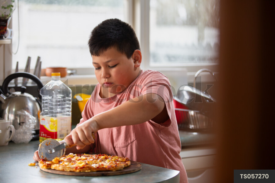 Young Boy with Homemade Pizza