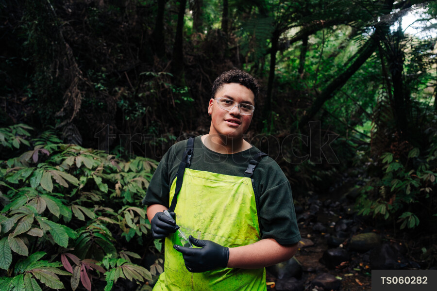 Portrait of a young man in forest
