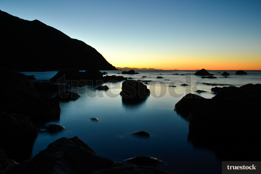 Sunset over the calm ocean water