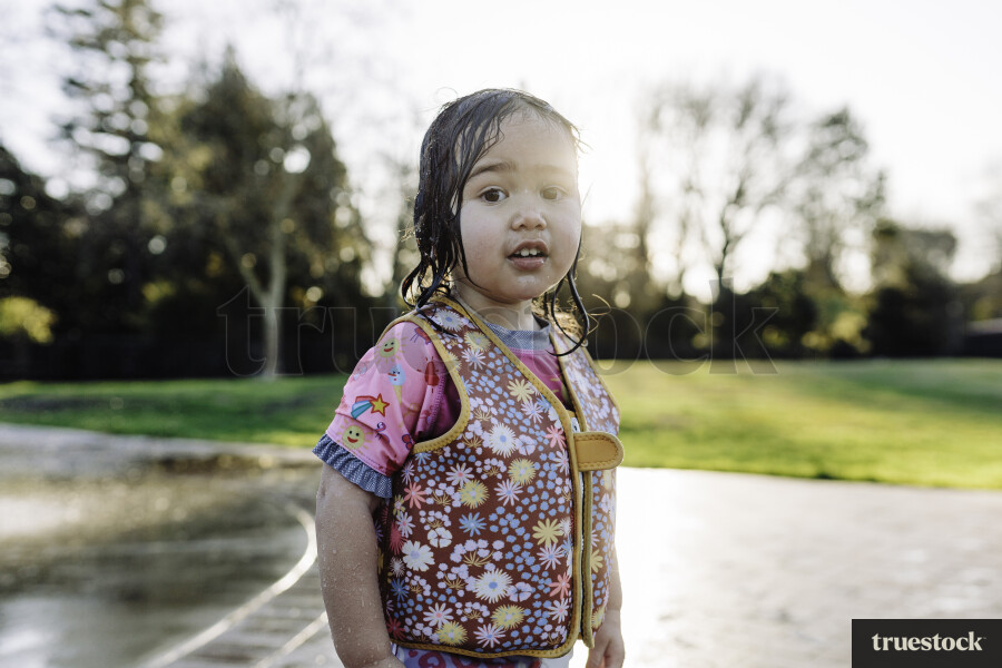 Young Girl Playing in Water