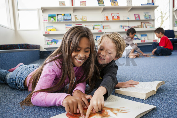 Young Kids Reading Book at School