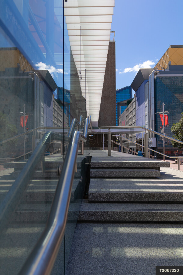 Reflections in window outside building in street