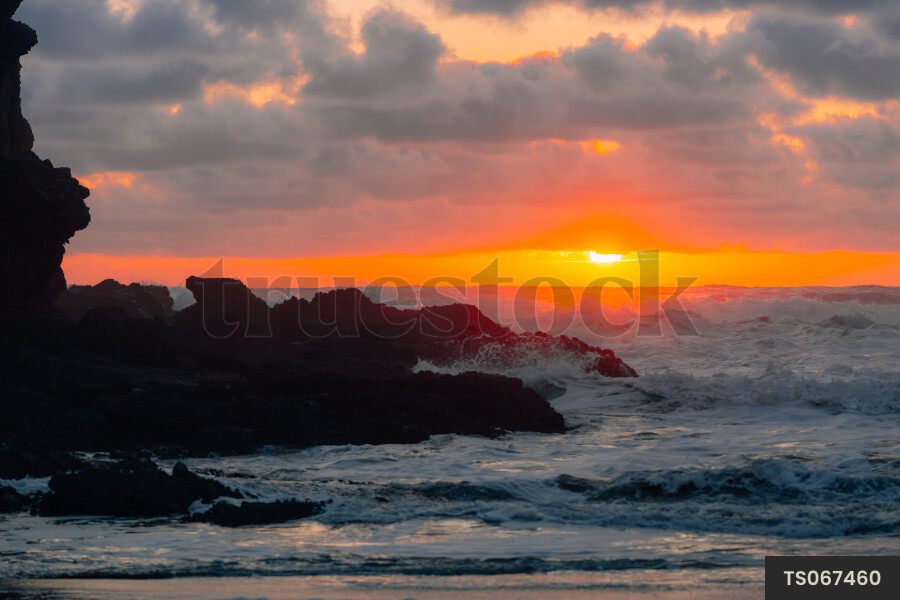 Waves on Bethells Beach at sunset