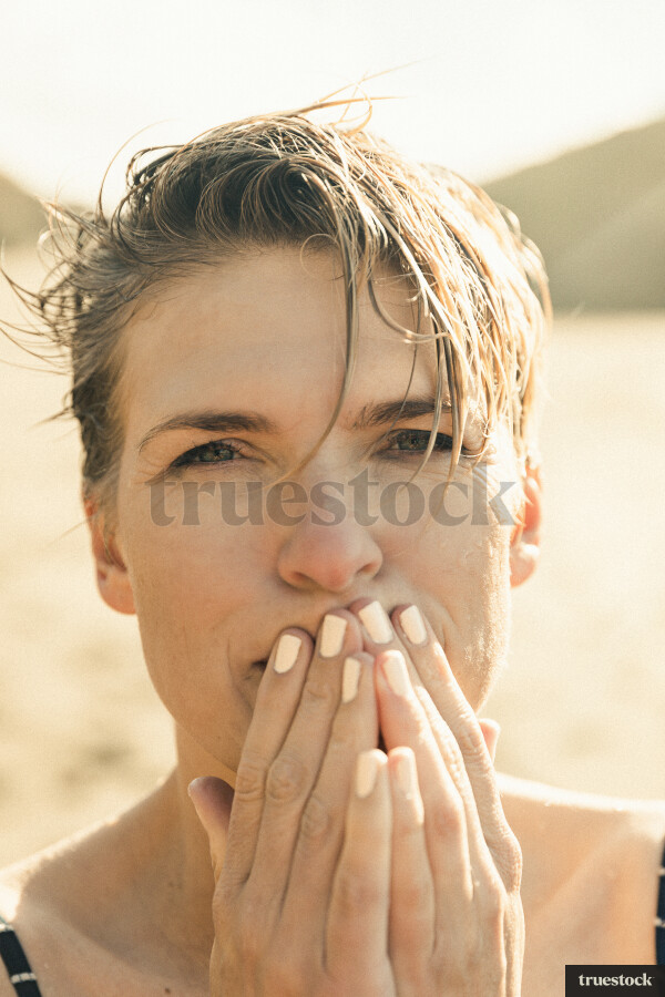 Woman Swimming at Piha Beach