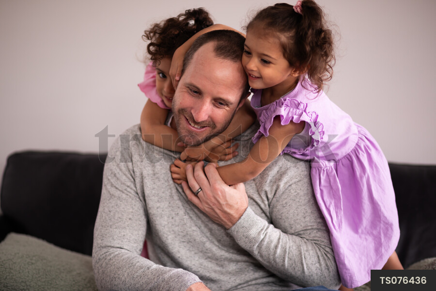 Man with his daughters on Father's Day