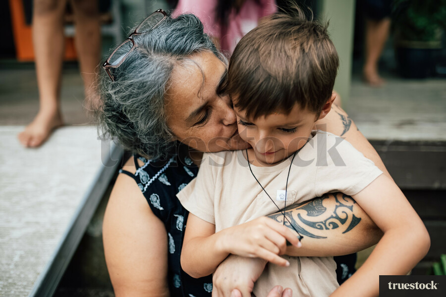 Grandmother Kissing Grandson