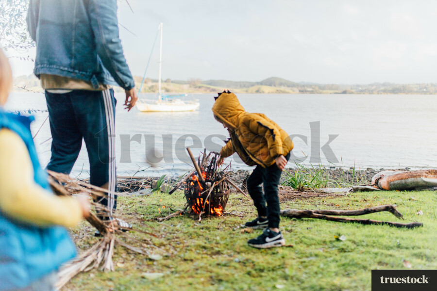 Family starting fire outside