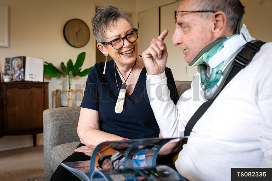 Health carer and patient with photo album