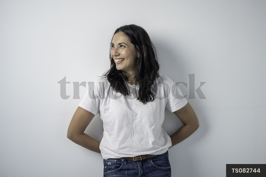 Portrait of happy middle-aged woman on white background