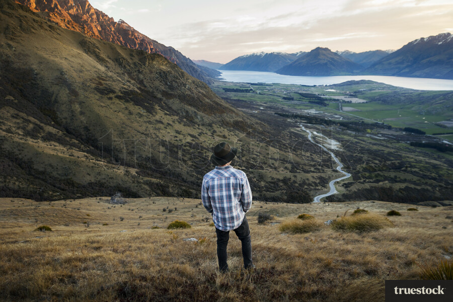 Man looking out over farmland