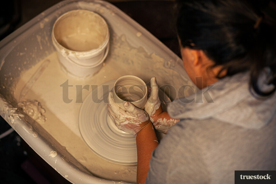Woman making pottery