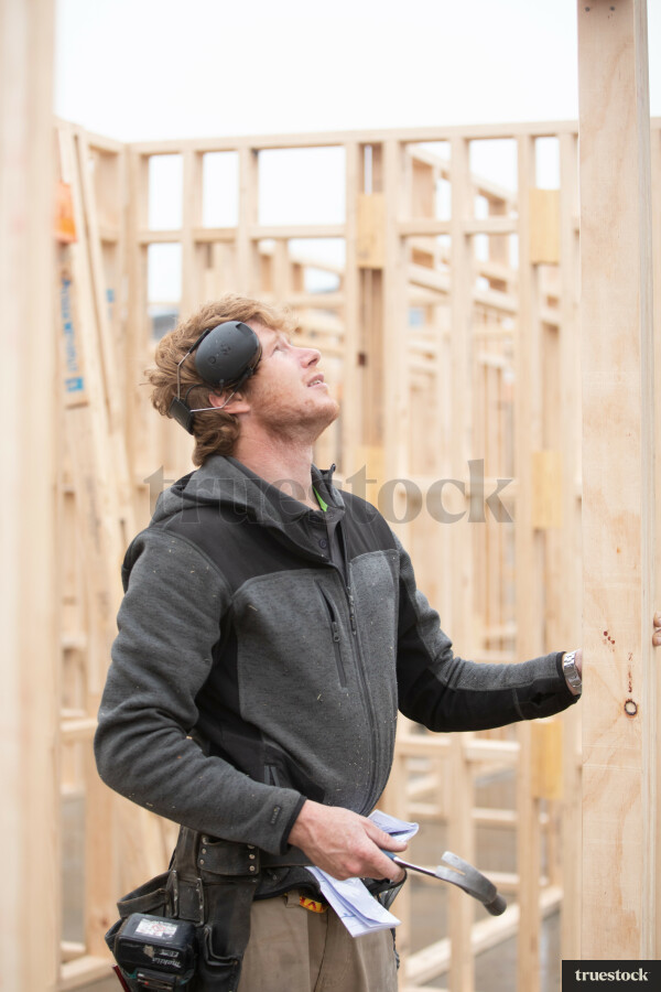 Builder onsite working on a new suburban house build