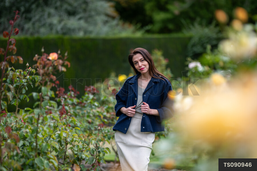 Woman with blue jacket in park