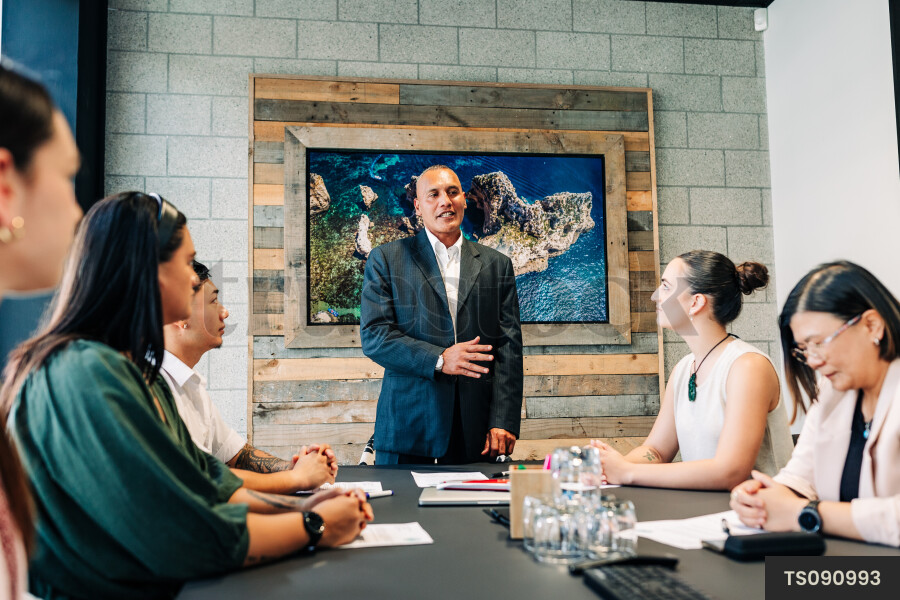Businesspeople talking during meeting in boardroom