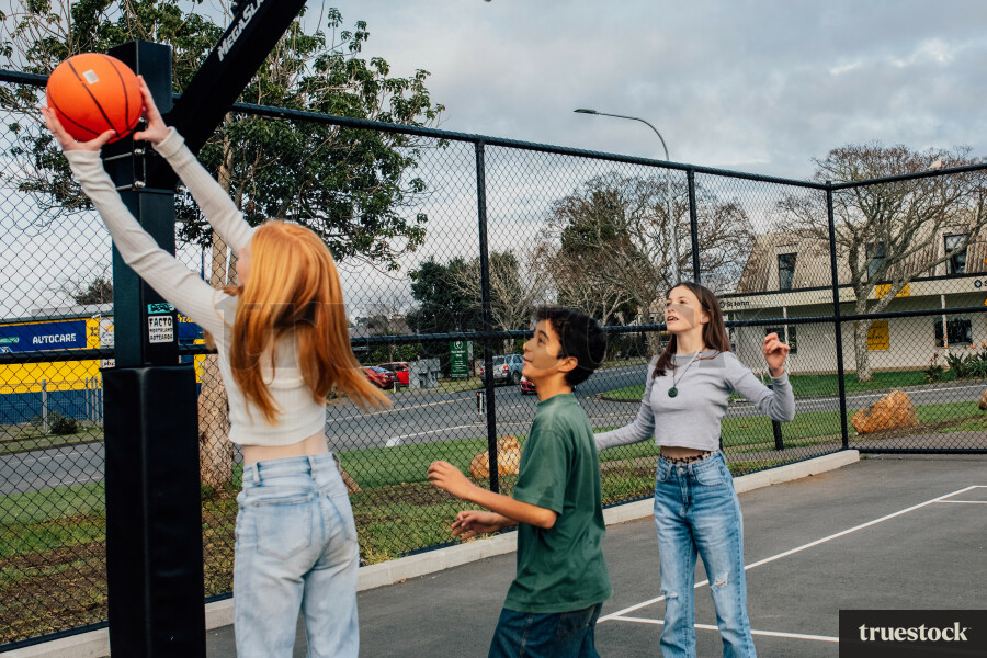 Teenagers Playing Basketball