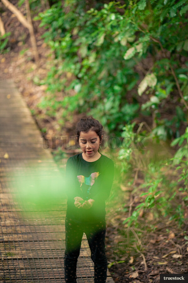 Young girl holding a leaf