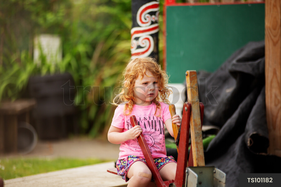 Girl playing in sandpit