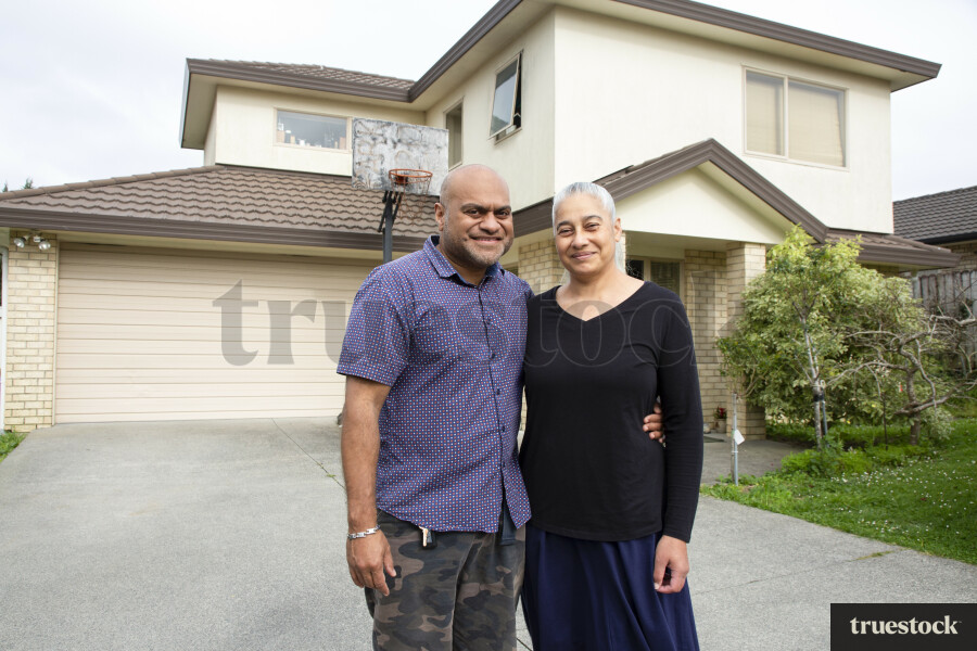 Couple in Front of House