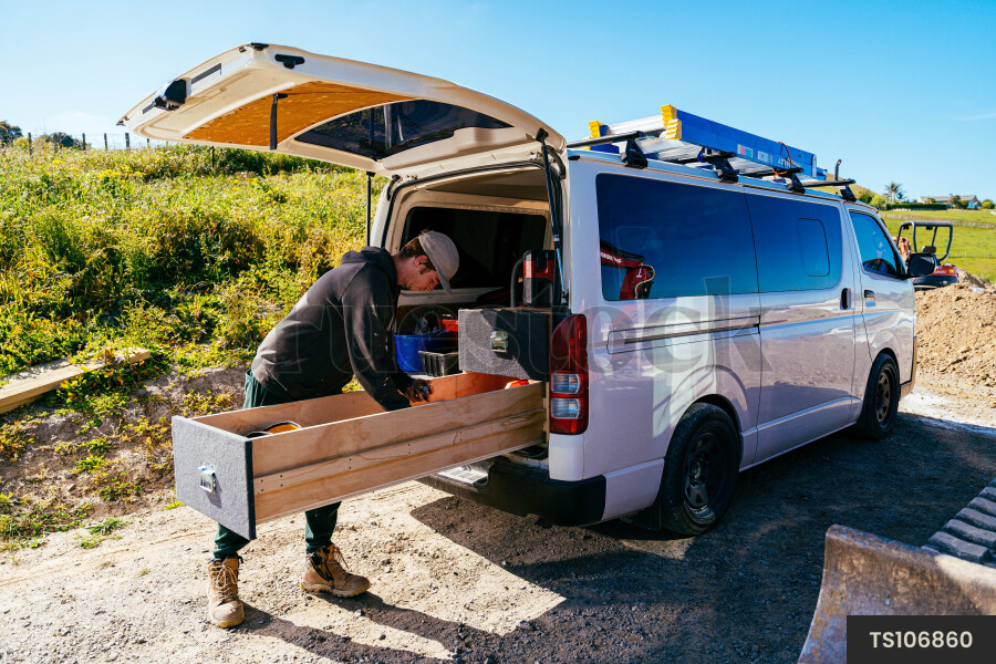 Plumber with tool box on construction site