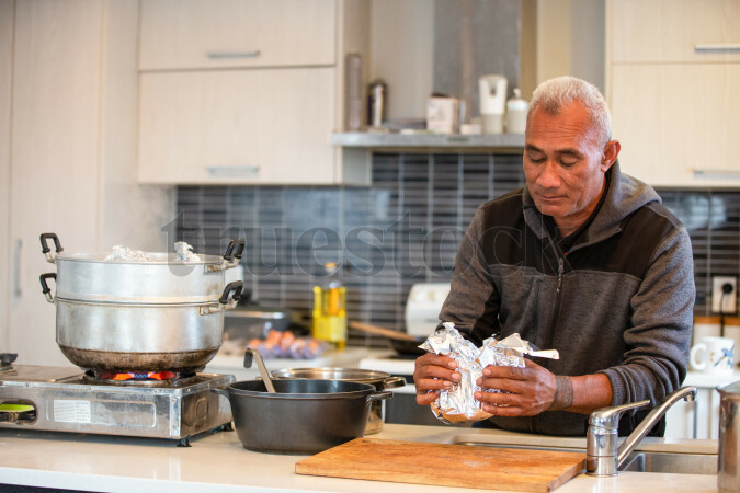 Samoan Man Cooking Palusami at Home