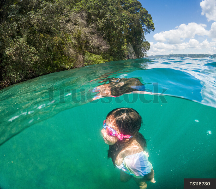 Girl swimming underwater