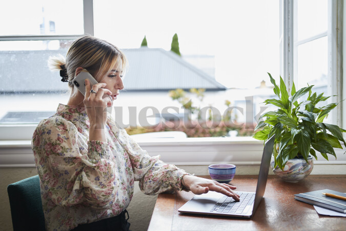 Woman on Phone Call While Working