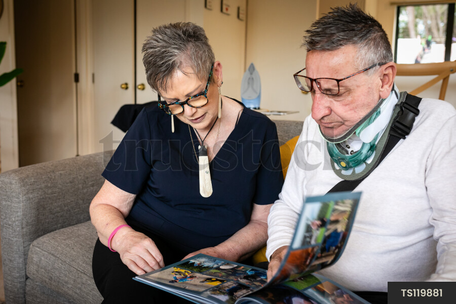 Health carer and patient with photo album