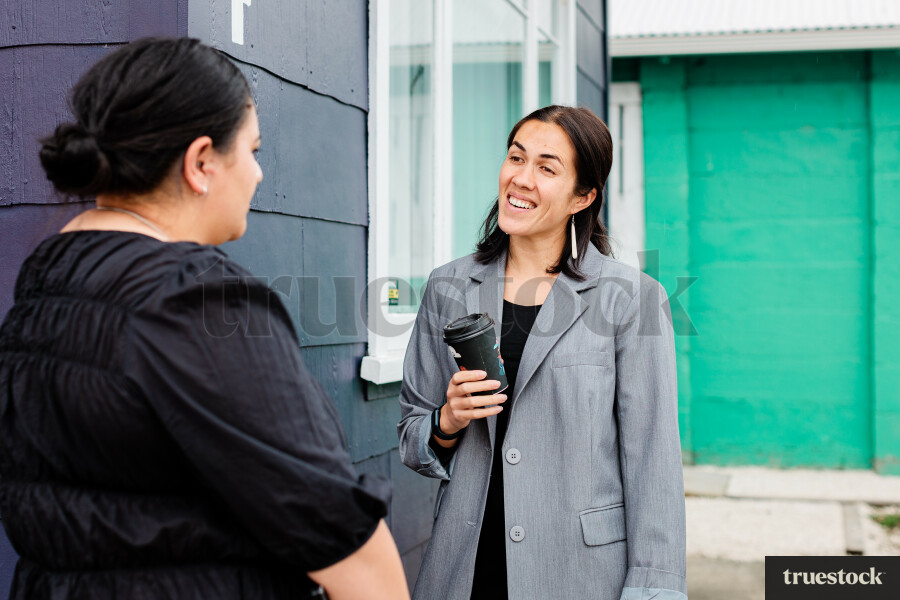 Colleagues Talking While Walking
