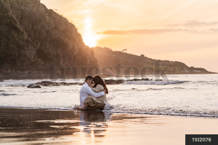 Couple Sitting in Tide