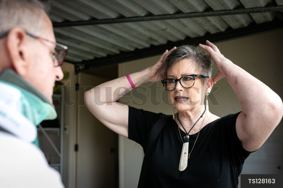 Health carer with patient in garage