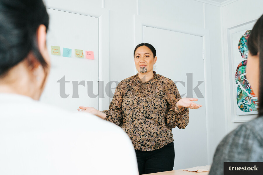 Woman Presenting in Meeting