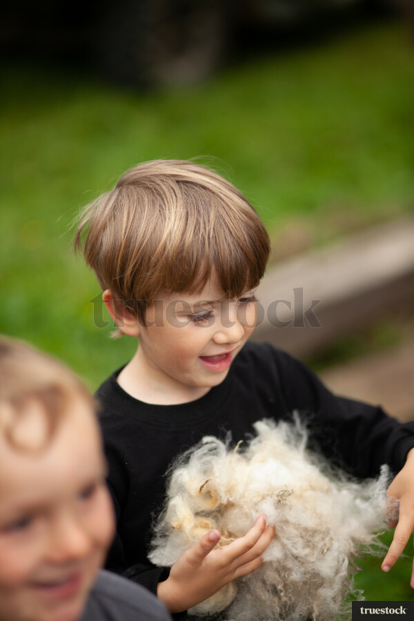 Boy holding wool