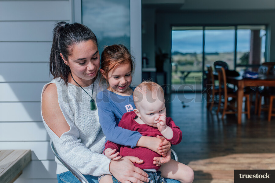 Mum Holding Two Daughters