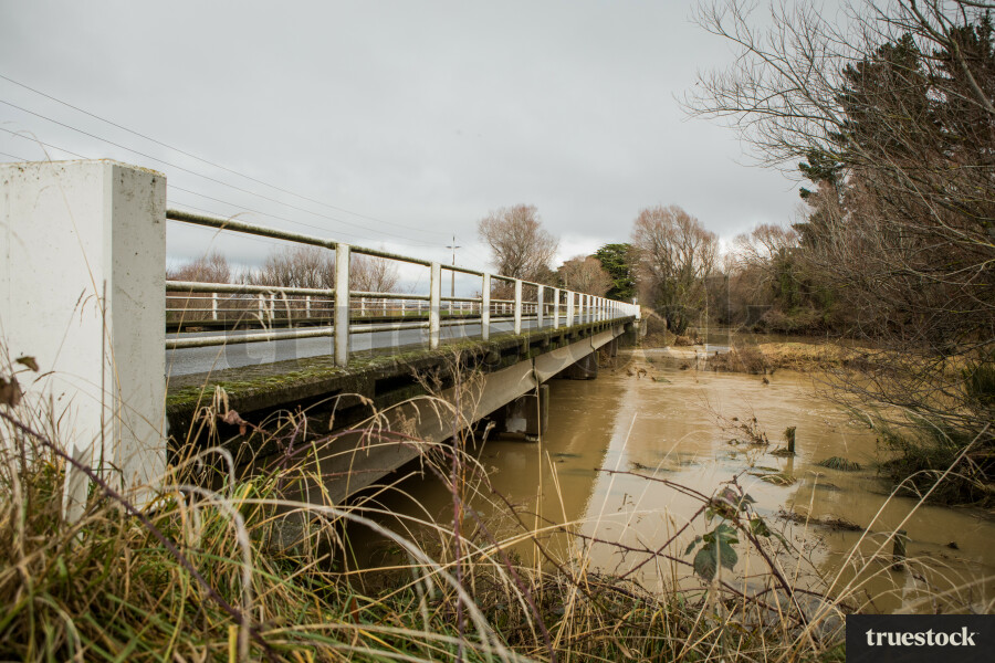 Rising river water and debris from flooding