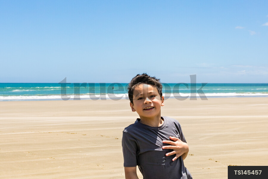 Boy playing on beach